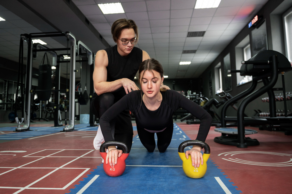 Yoga class group practicing stretching exercises in a modern fitness studio
