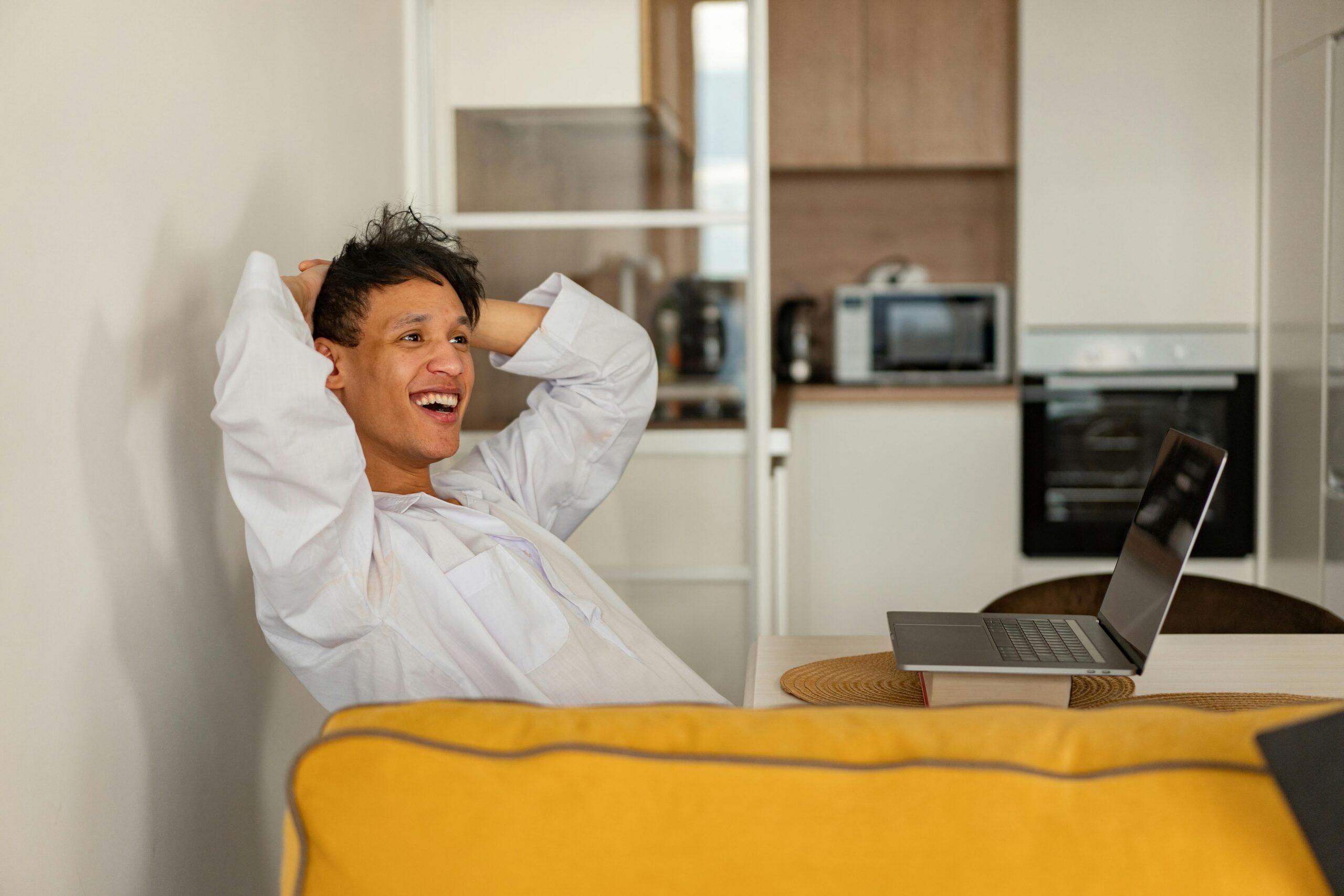 Person sitting calmly with eyes closed practicing deep breathing and relaxation to manage stress and improve mental well-being during a stressful day.
